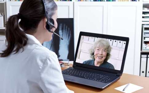 Doctor speaking to patient via video calling